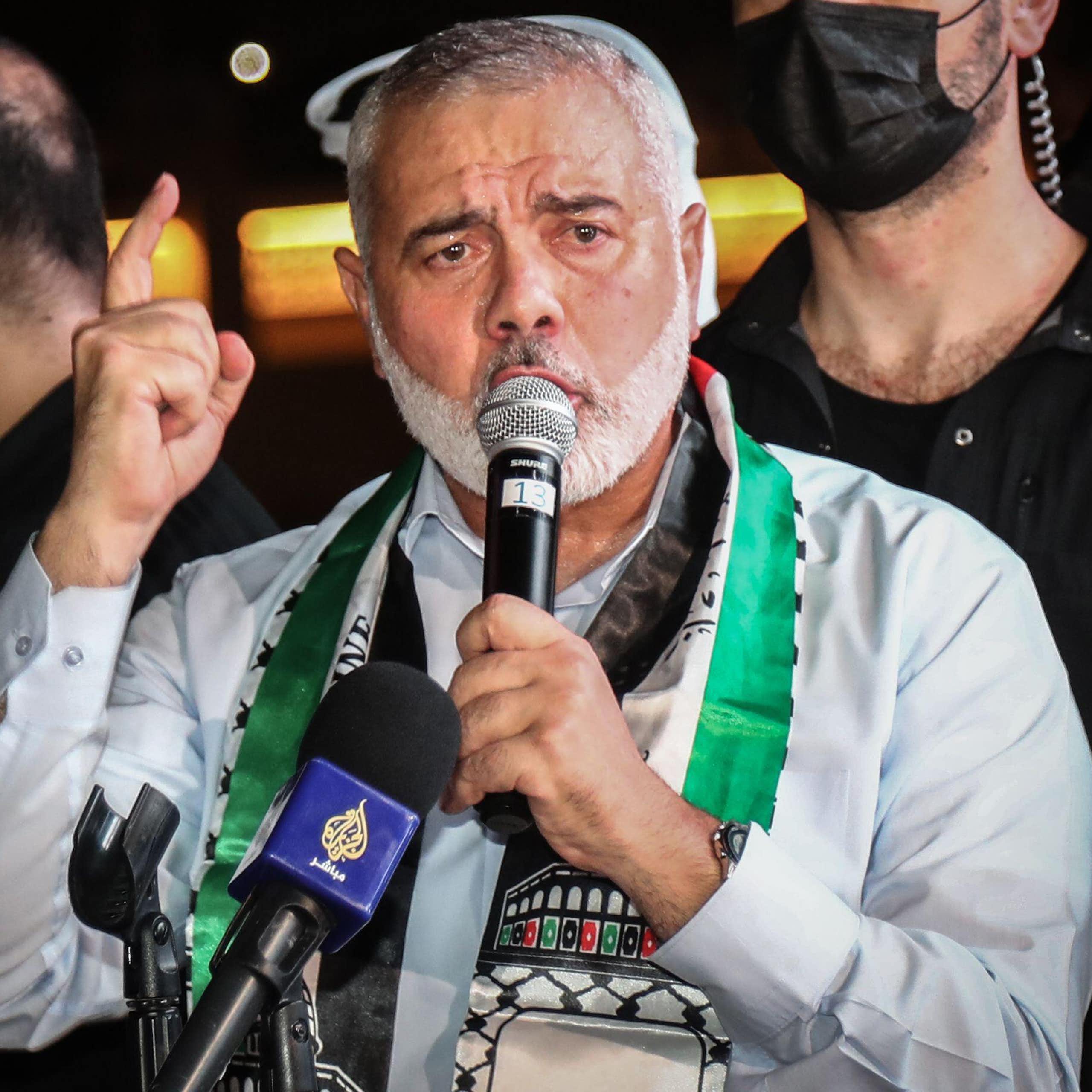Ismail Haniyeh speaking into a microphone.