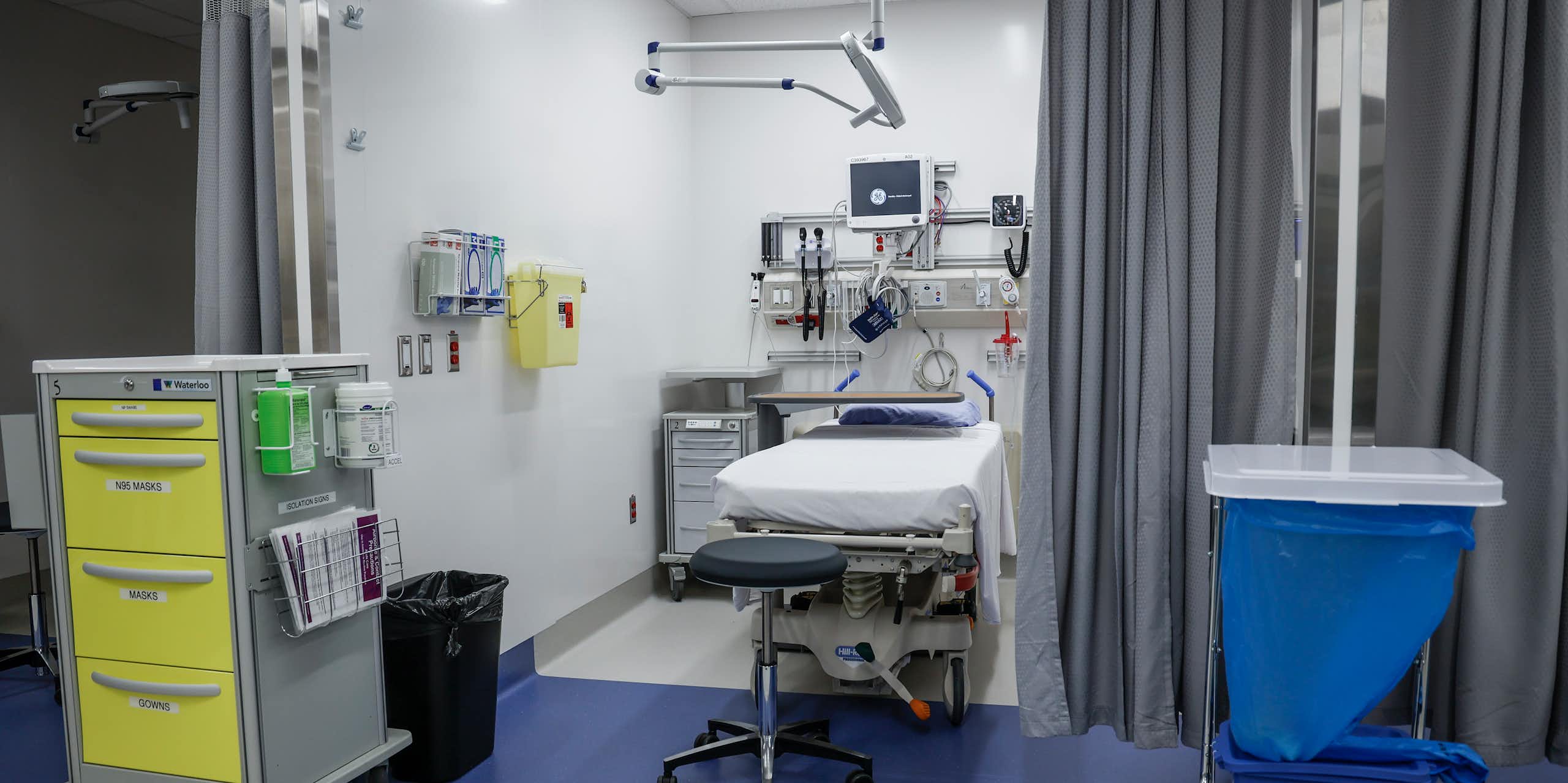 A curtained-off exam space in a health-care facility
