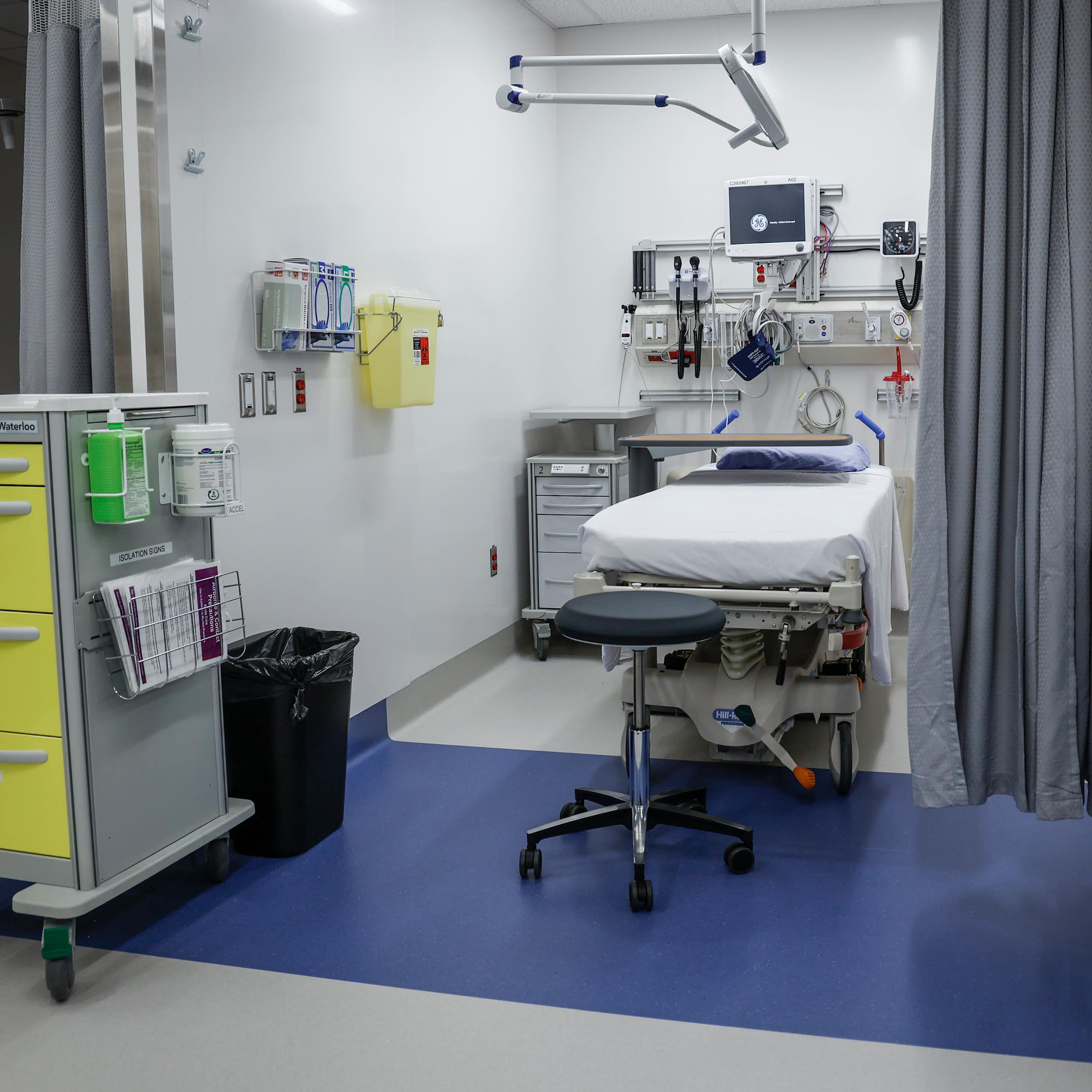 A curtained-off exam space in a health-care facility
