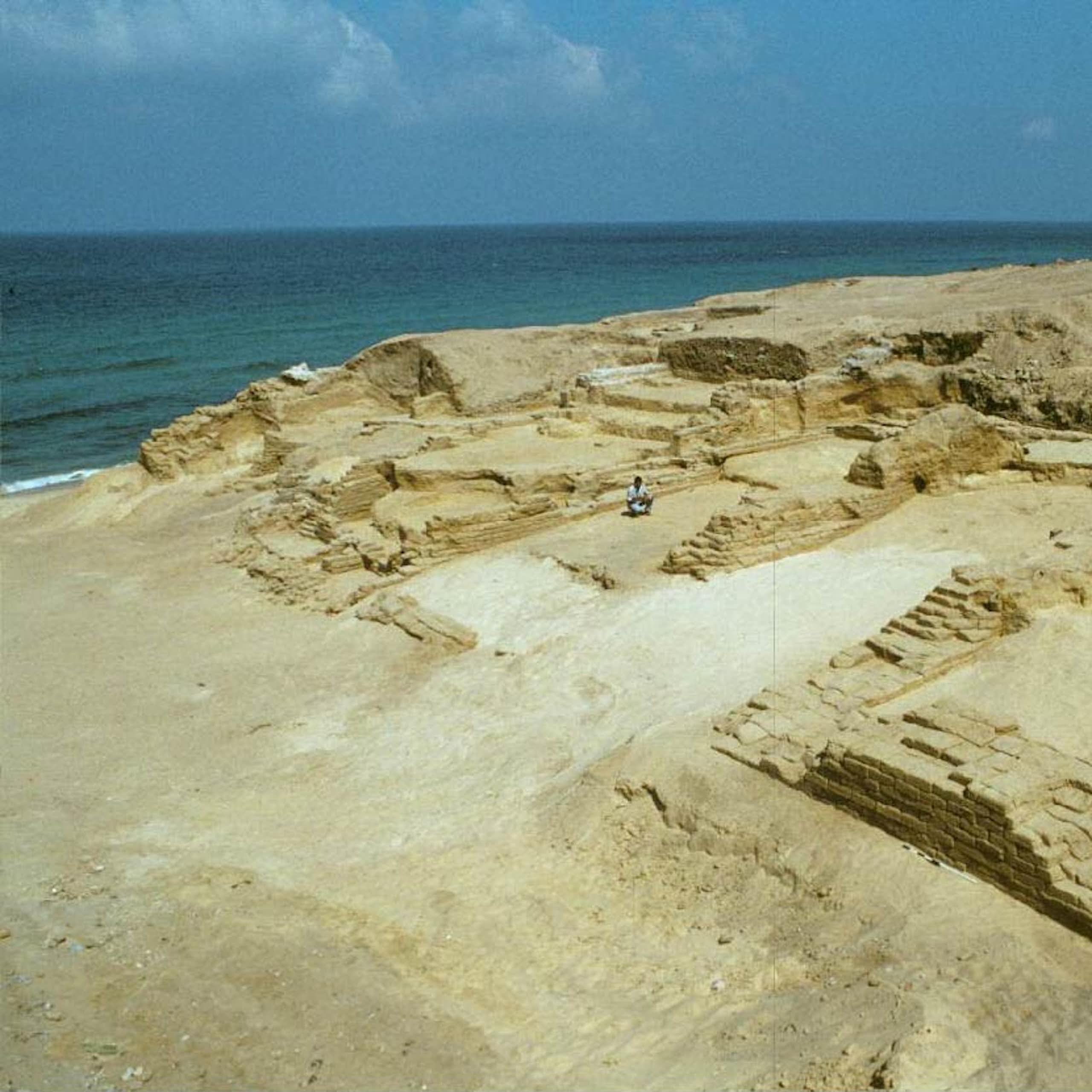 Photograph of an archaeological site next to the sea