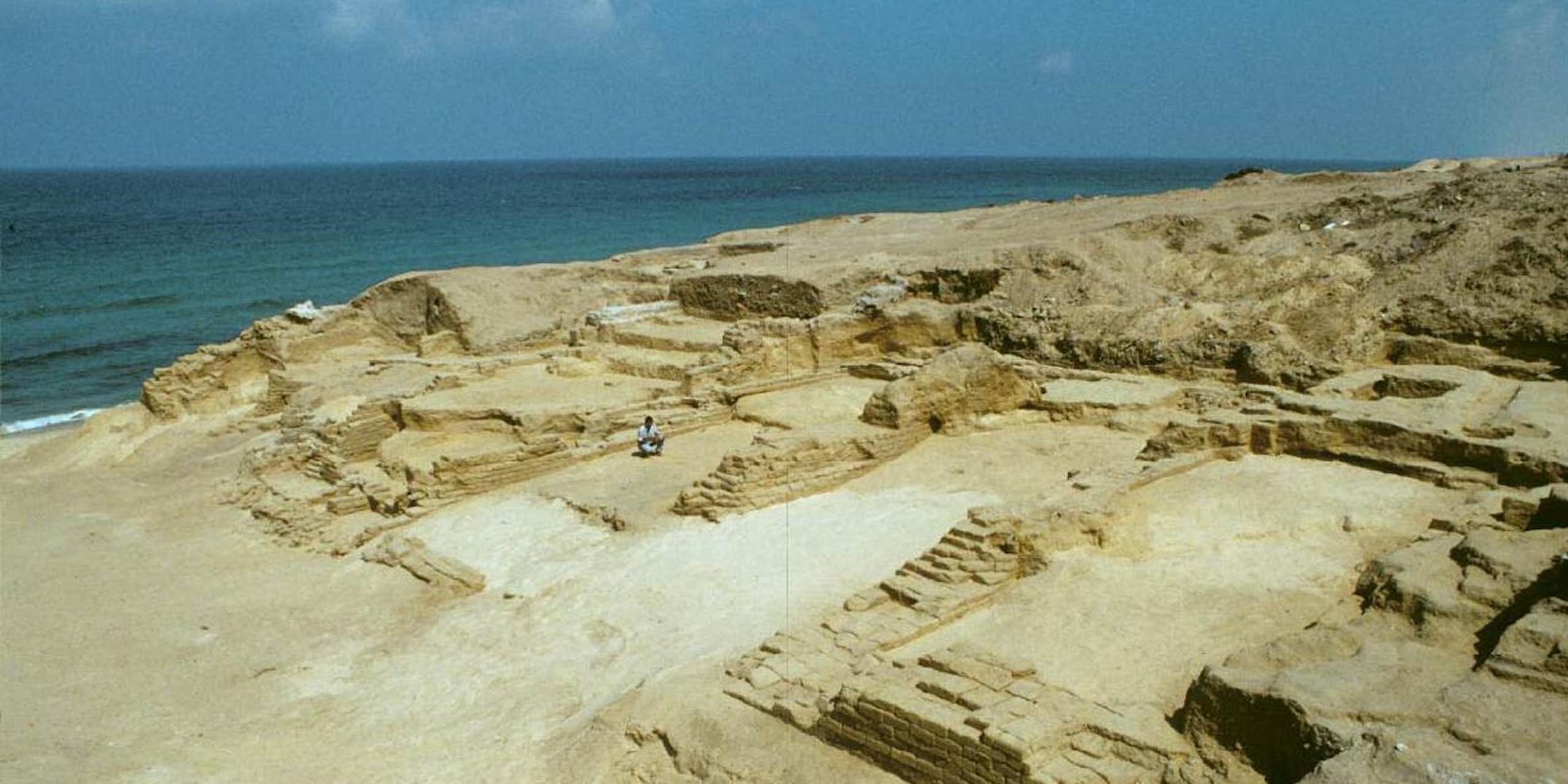 Photograph of an archaeological site next to the sea