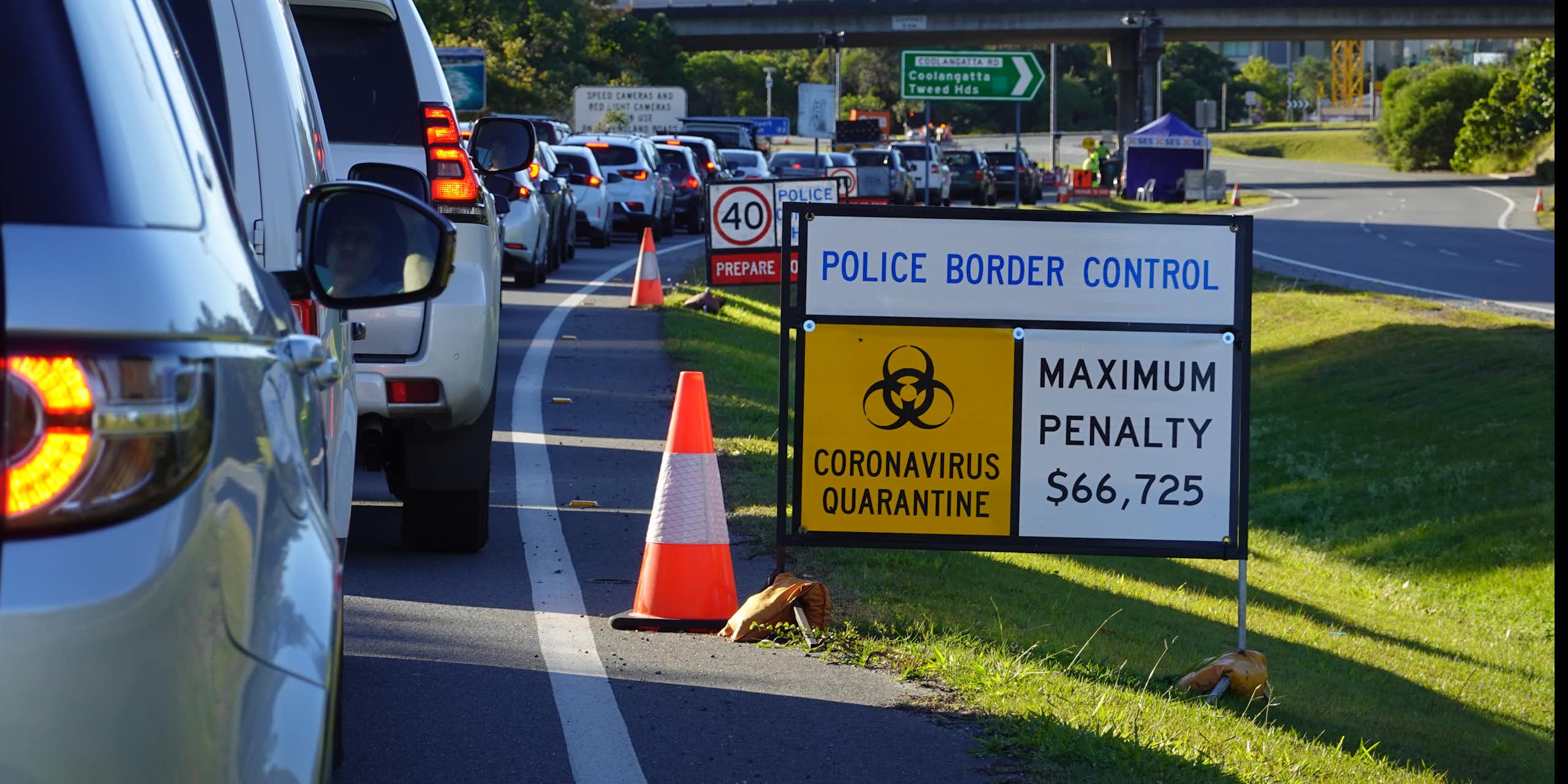Cars waiting at a COVID checkpoint.