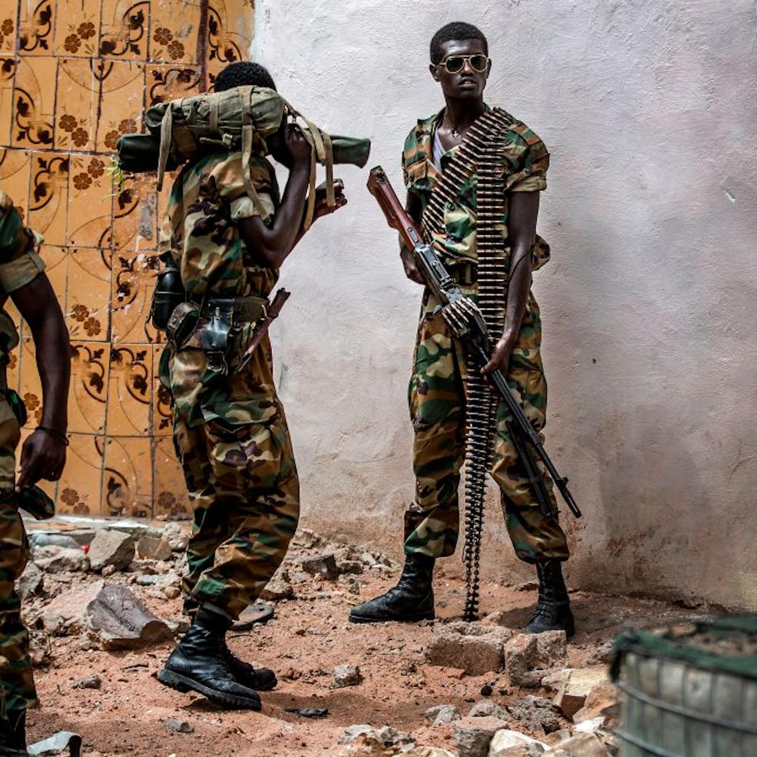 Heavily-armed soldiers on street patrol