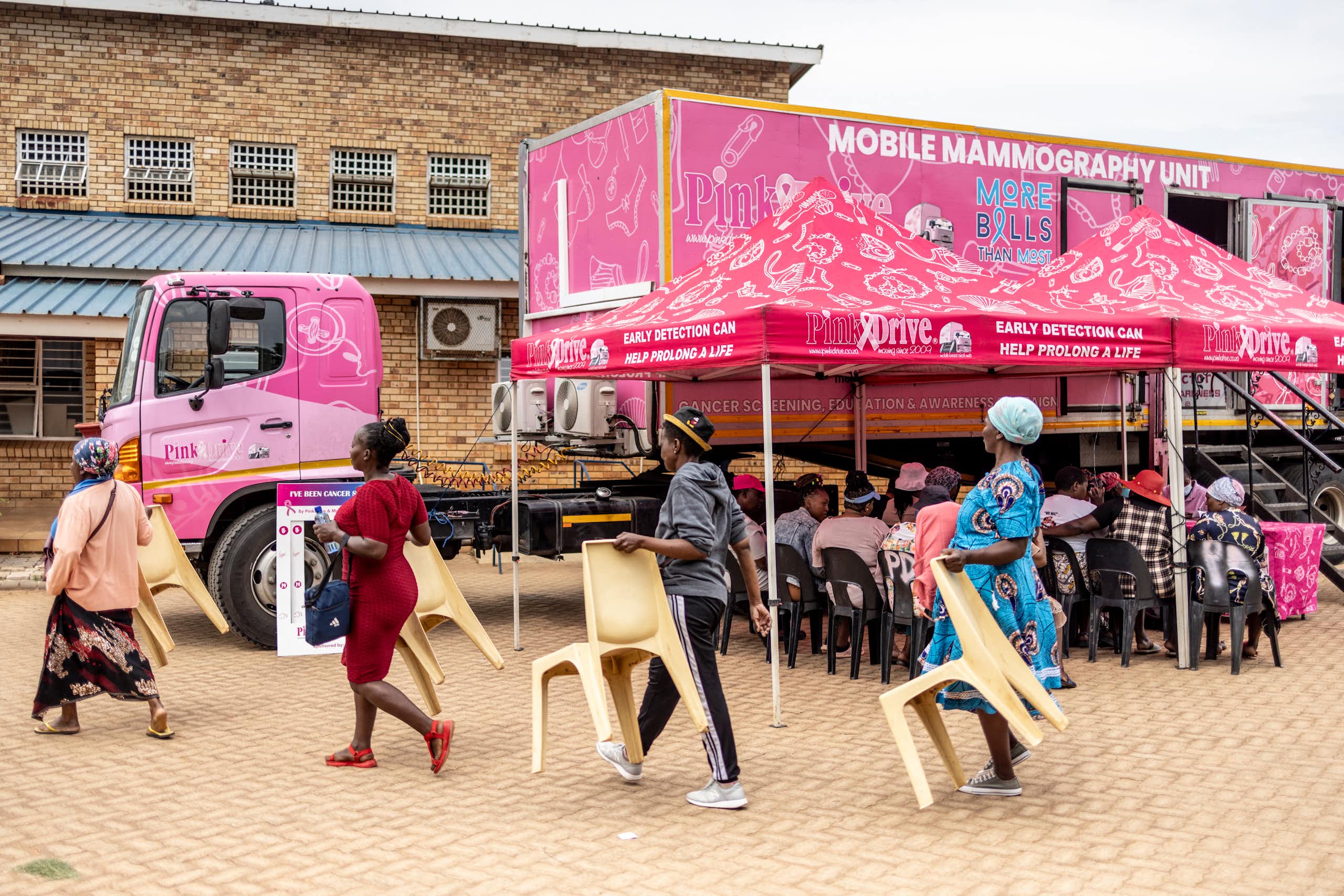 Patients and chairs during breast cancer screening drive 
